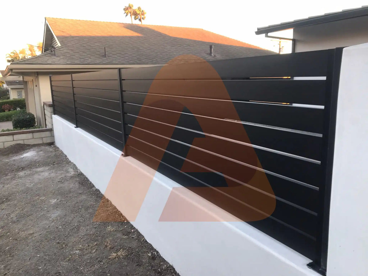 Black ALU 40 aluminum slat fence mounted on a wall