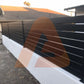 Black ALU 40 aluminum slat fence mounted on a wall