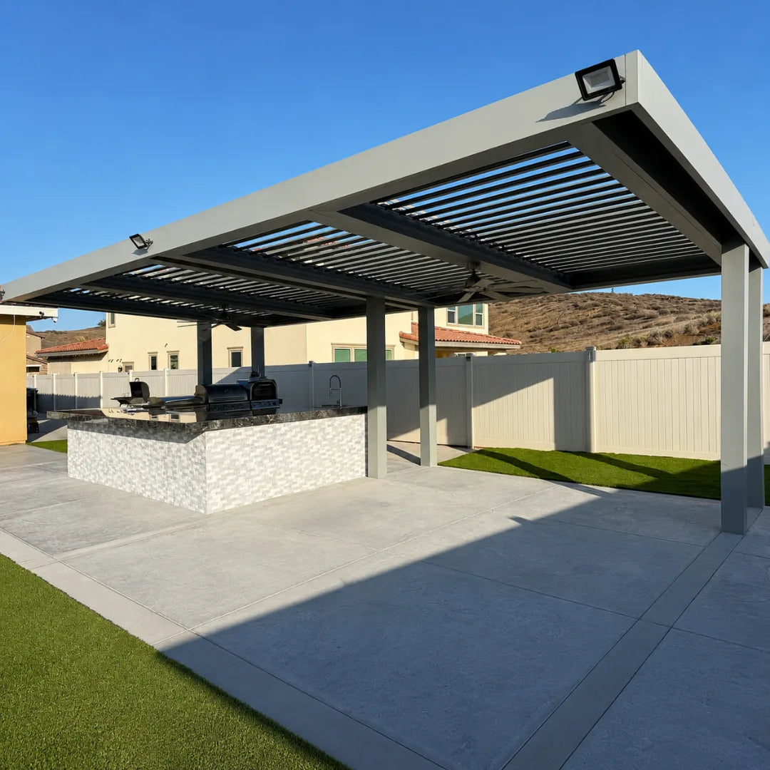 Motorized louver patio cover over an outdoor kitchen