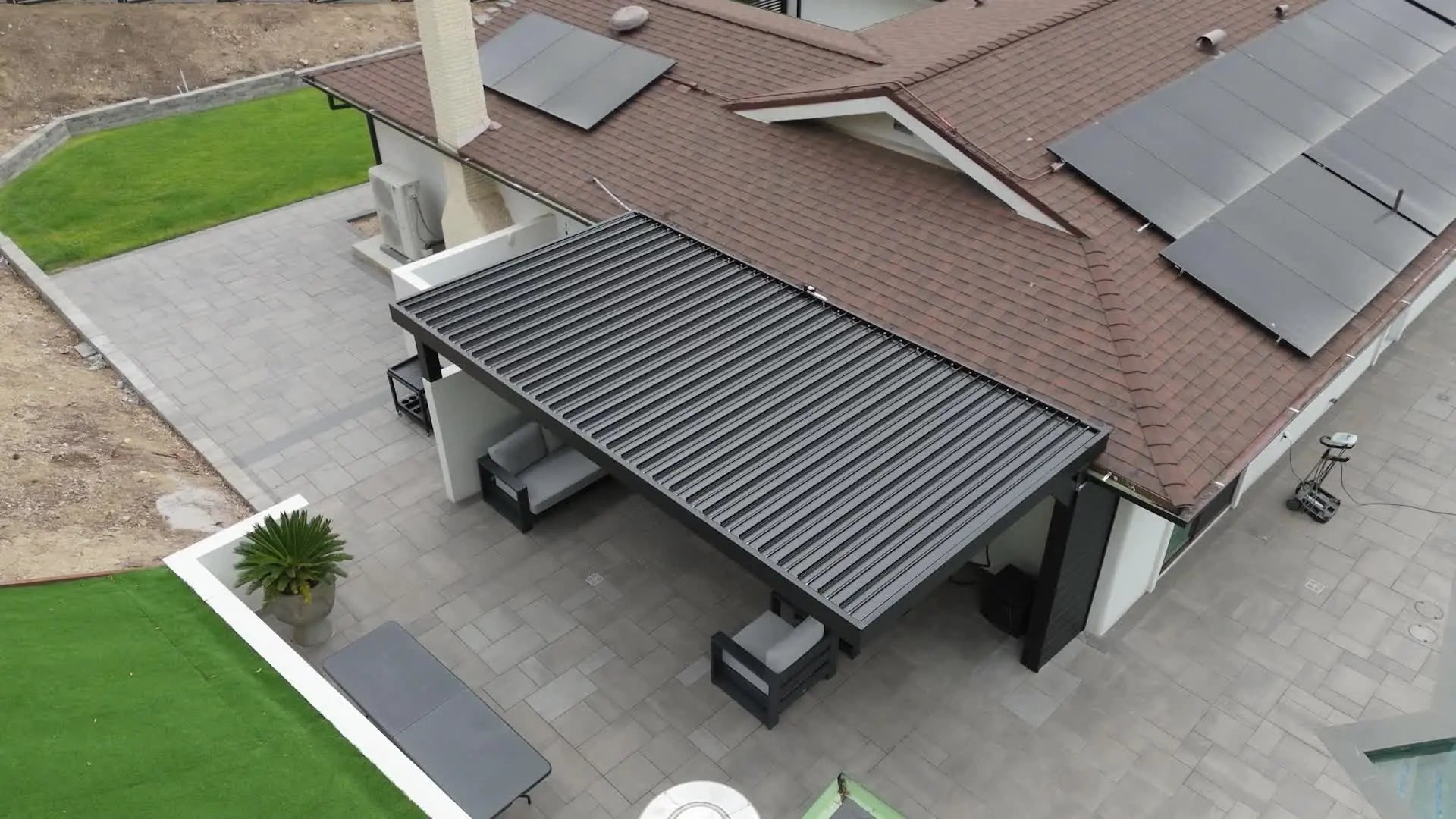 Aerial view of a large multi-bay aluminum louver patio system